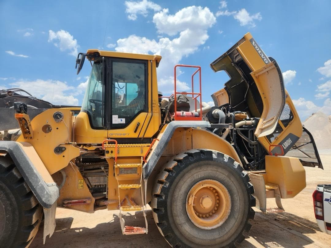 Wheel loader photographed on site under a blue sky