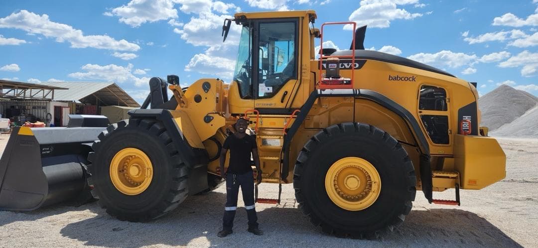 Wide site photo showing heavy equipment positioned in an operating area