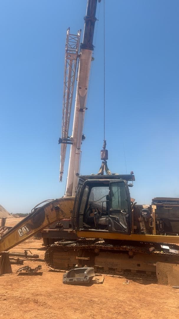 Crane and excavator positioned during field support work