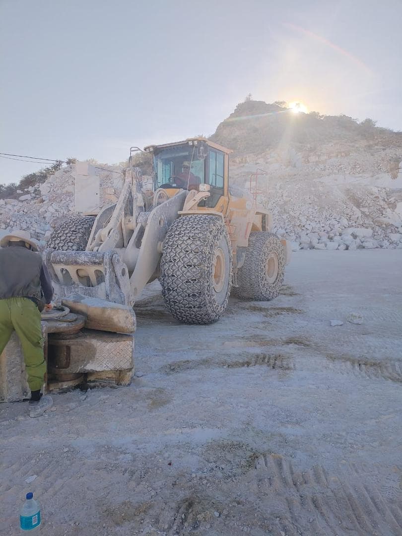 Wheel loader positioned in a quarry environment during support work